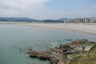 a view of a beach with the ocean at EnFOZ Playa A Rapadoira in Foz