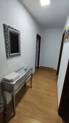 a room with a desk and a mirror on the wall at Apartamento Rio Sar garaje incluido in Santiago de Compostela