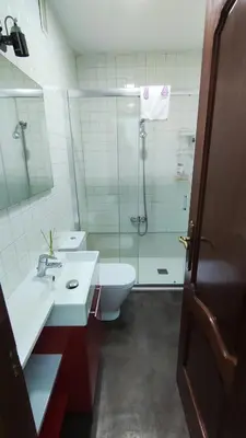 a bathroom with a shower and a sink and a toilet at Apartamento Rio Sar garaje incluido in Santiago de Compostela