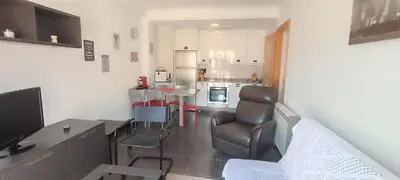 a kitchen with a couch and a chair in a room at Alojamiento Misericordia in Viveiro