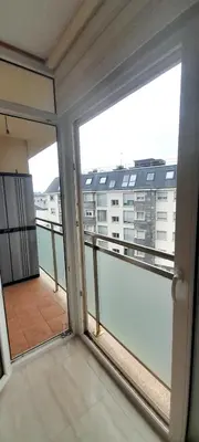 a balcony with a view of a building at EnSAN CIPRIAN Con Playa Piscina y Parking in San Ciprián