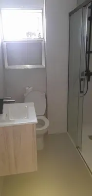 a bathroom with a toilet and a sink and a shower at EnSAN CIPRIAN Atico en Urb Río Cobo in San Ciprián