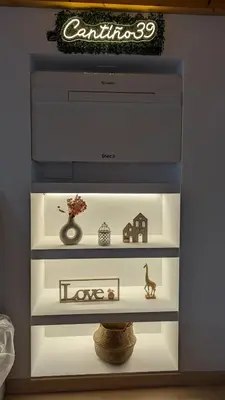 a shelf with various items in a room at Cantiño 39 in Lugo