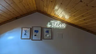 a sign on a wall with pictures on a wall at Cantiño 39 in Lugo