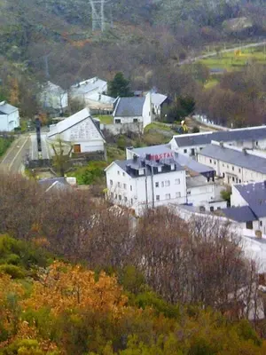 a small town with white buildings on a hill at Hostal Martin - Sanabria in Ribadelago