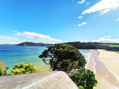 a view of a beach with a tree on it at EnVIVEIRO Villa Bonita in Viveiro