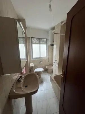 a bathroom with a sink and a toilet at Miño Center Home in Miño