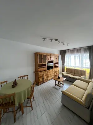 a living room with a couch and a table at Miño Center Home in Miño