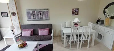 a living room with a couch and a table at Apartamento PLAYAS Y SIRENAS SAN CIPRIÁN in San Ciprián