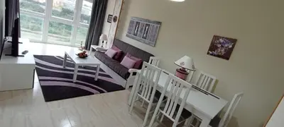 a living room with a couch and a table at Apartamento PLAYAS Y SIRENAS SAN CIPRIÁN in San Ciprián