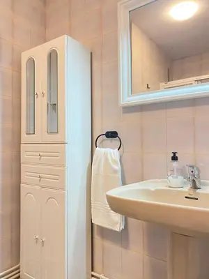 a bathroom with a sink and a medicine cabinet at Apartmento O Río in Burela de Cabo
