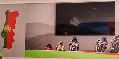 a wall with a picture of a group of people riding motorcycles at Hotel Luso Leixoes-Exclusivo para Empresas in Bergondo
