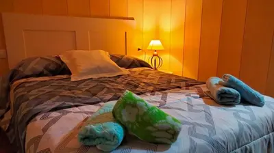 a bedroom with a bed with stuffed animals on it at playa de covas-Viveiro apartment in Viveiro