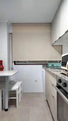 a kitchen with white cabinets and a white counter top at playa de covas-Viveiro apartment in Viveiro