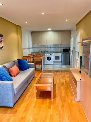 a living room with a couch and a table at Vistas Miño II in Ourense