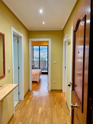 a hallway with a door leading to a bedroom at Vistas Miño II in Ourense