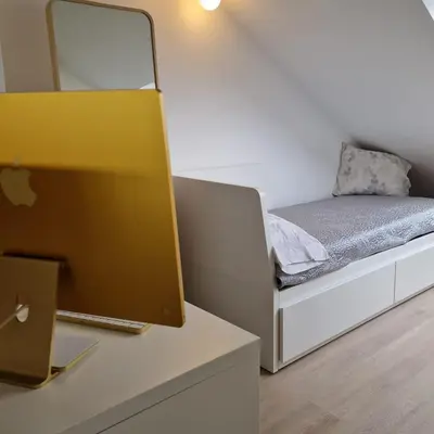 a small bedroom with a bed and a mirror at Perbes Dreams in Perbes