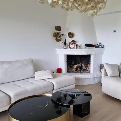 a living room with a couch and a fireplace at Perbes Dreams in Perbes