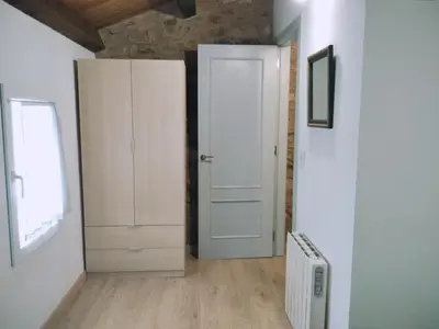 a room with a door and a window and a radiator at Encantadora casa con unas magníficas vistas in Ribadeo