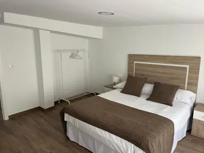 a bedroom with a large bed in a room at Casa da Morena in Foz