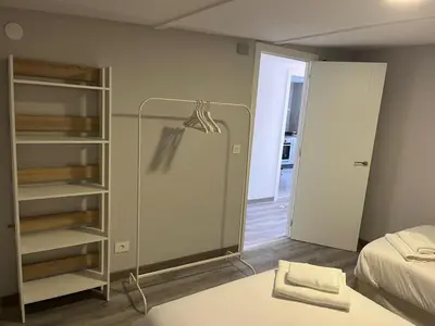 a room with a bed and a glass closet at Casa da Morena in Foz