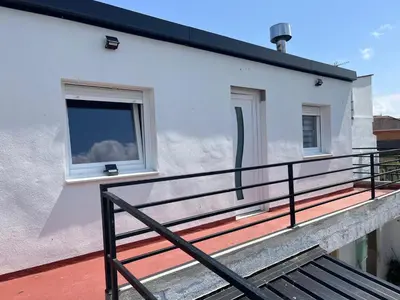 a balcony with a window on the side of a building at Casa da Morena in Foz