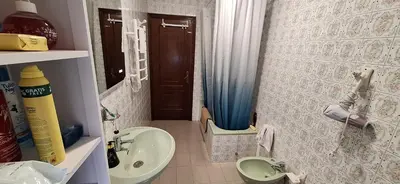 a small bathroom with a sink and a toilet at Casa Diego, primera línea de playa junto a las Catedrales in Barreiros