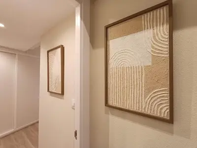 a hallway with a painting on the wall at SF - Luminoso, amplio y recién reformado en el casco histórico in Ourense