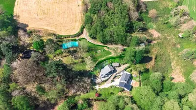 an overhead view of a house in a forest at Casa rural en Playa de Frejulfe in Frejulfe
