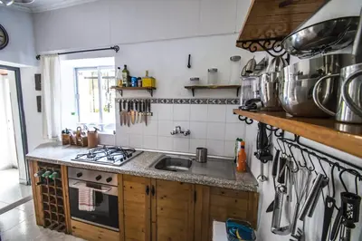 a kitchen with a sink and a stove top oven at Casa rural en Playa de Frejulfe in Frejulfe