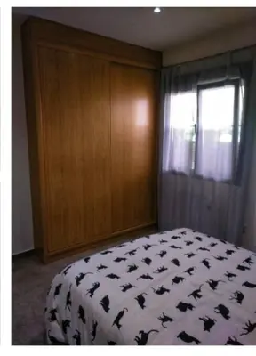 a bedroom with a bed and a window at Gatonegro in Trefacio