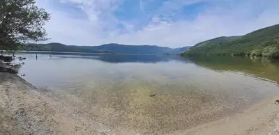 a view of a lake with mountains in the background at Casas rurales en Sanabria in Coso