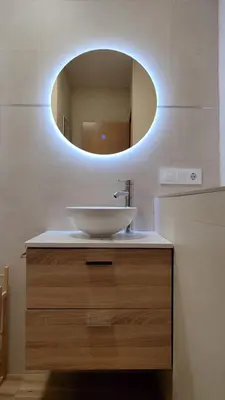 a bathroom with a sink and a mirror at Casas rurales en Sanabria in Coso