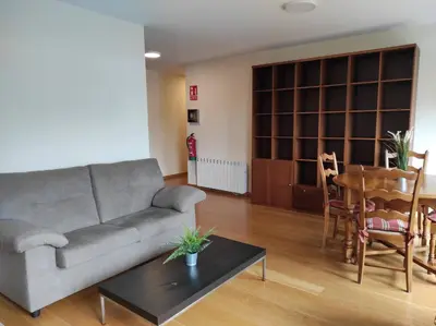 a living room with a couch and a table at Figueras 3 in figueras