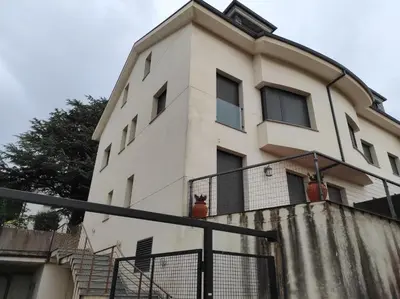 a white building with stairs in front of it at Figueras 3 in figueras