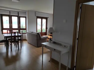 a living room with a table and a couch at Figueras 4 in figueras