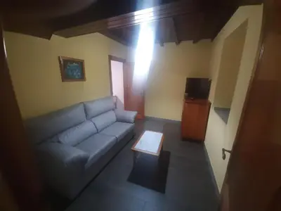 a living room with a couch and a coffee table at Casa valido in Lago