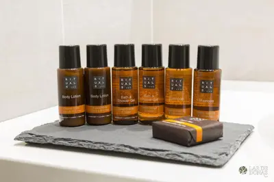a group of four bottles of essential oils and a charger at Lar de Donas in Meira