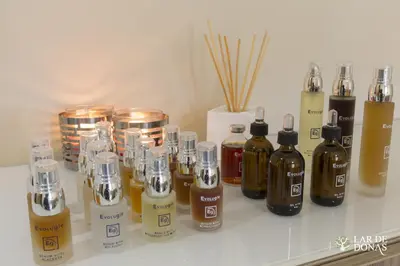 a group of bottles of essential oils sitting on a counter at Lar de Donas in Meira