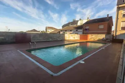 a swimming pool on the roof of a house at Ático Paraíso in San Ciprián