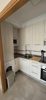 a kitchen with a sink and a toilet in it at Ático Paraíso in San Ciprián