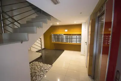 a hallway with a staircase in a building at Ático Paraíso in San Ciprián