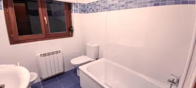 a bathroom with a toilet and a glass shower at Figueras 6 in figueras
