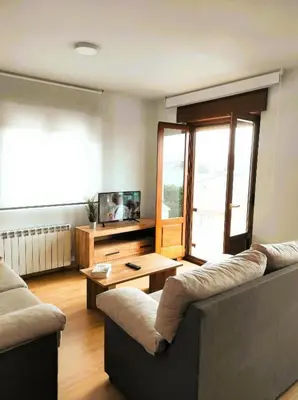 a living room with a couch and a table at Figueras 6 in figueras