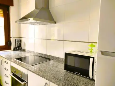a kitchen with a sink and a microwave at Figueras 6 in figueras