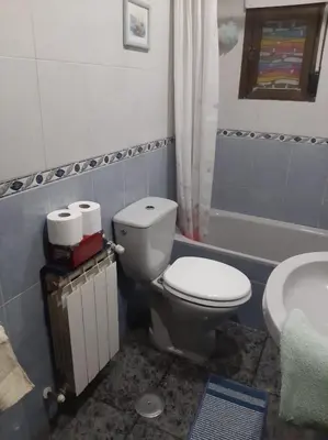 a bathroom with a toilet and a sink at Medulillas de Yeres in Yeres