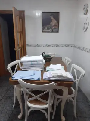 a table with two chairs and a table with papers on it at Medulillas de Yeres in Yeres
