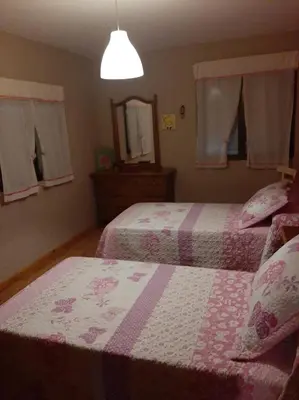 a bedroom with two beds and a mirror at Medulillas de Yeres in Yeres
