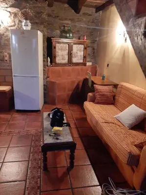 a living room with a couch and a refrigerator at Medulillas in Yeres