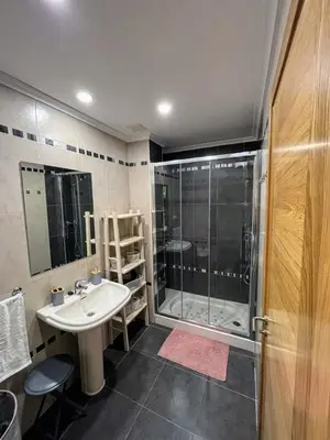 a bathroom with a sink and a shower at Ilusiones Da Mariña in San Ciprián